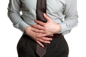 Businessman with stomach ache